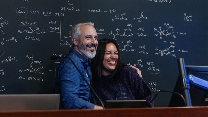A warm moment between Award for Trainee Mentorship recipient Alex Salazar and her advisor, Gabriel Lander