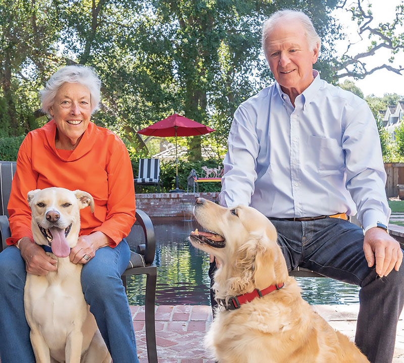 Sue Diekman with Benny and John Diekman with Sage. Benny was adopted from the Humane Society Silicon Valley. Credit: Gerry Serrano